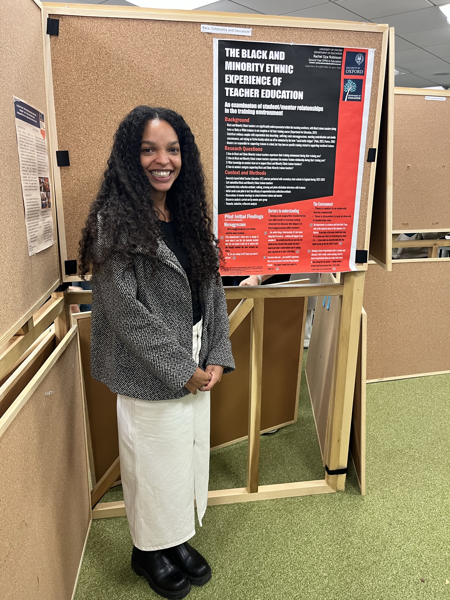 Rachel Robinson standing with poster