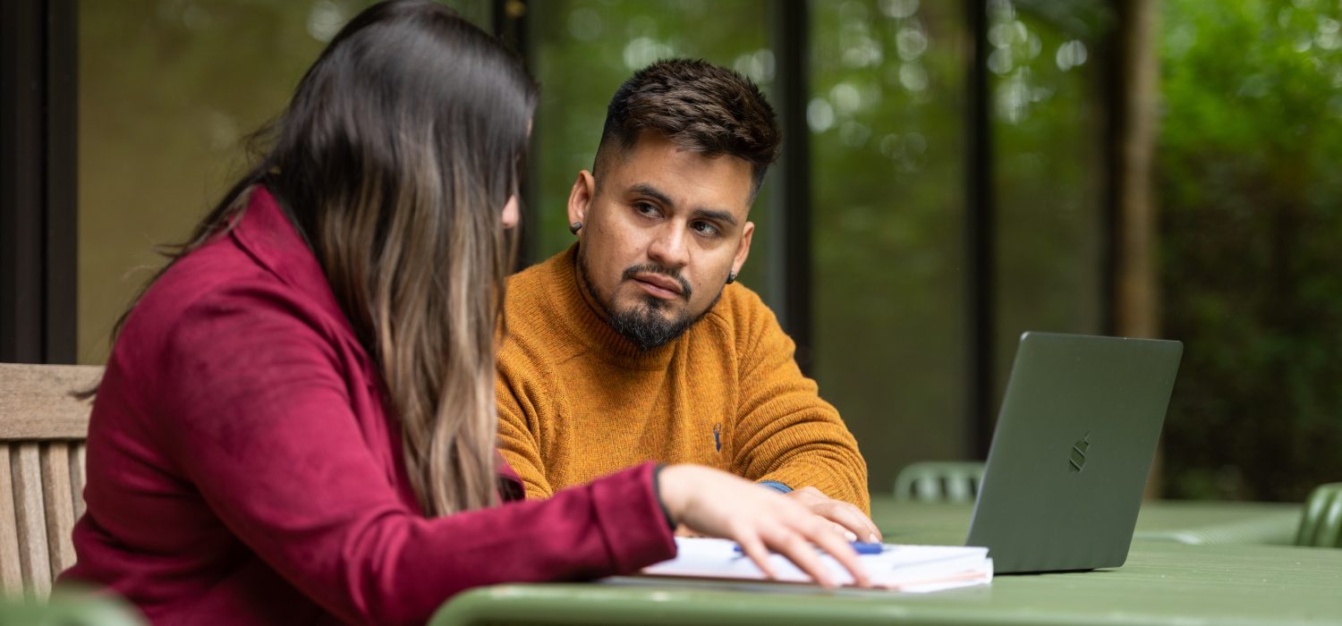 Students talking at a table