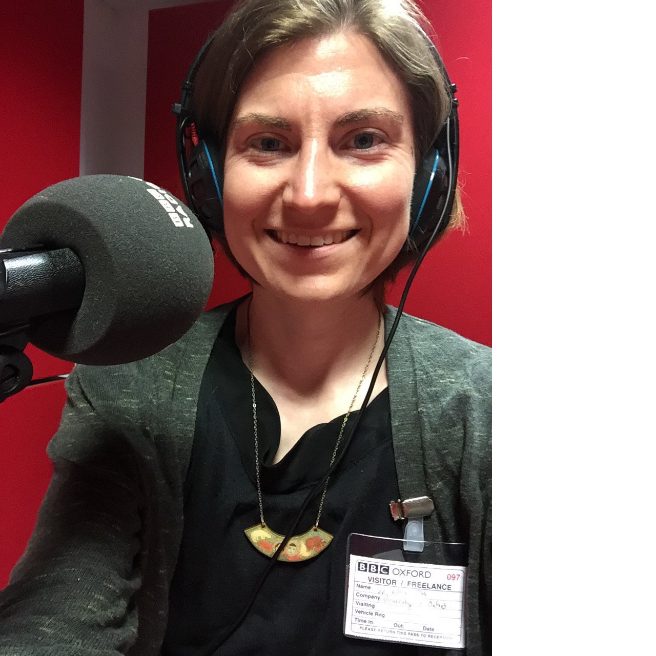Dr Ellie Ott with a radio microphone and headphones