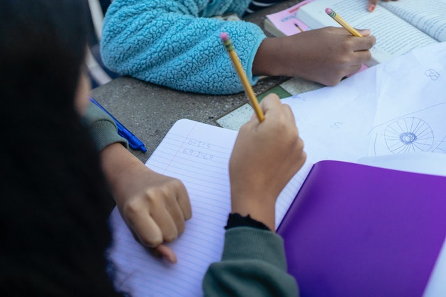 School children writing