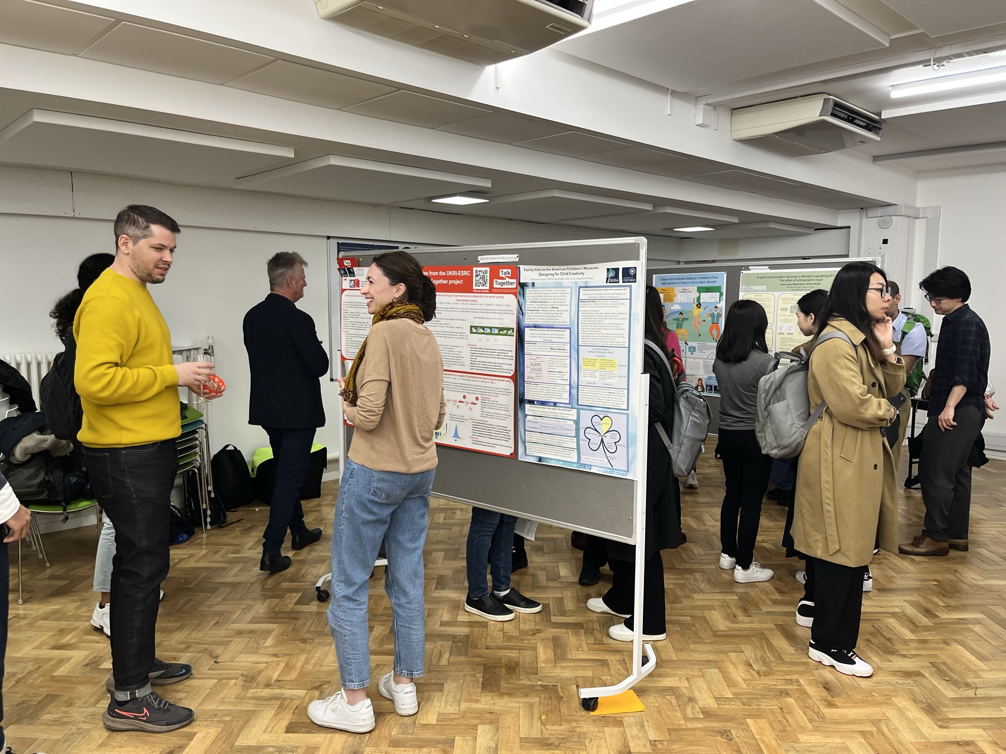 People viewing posters