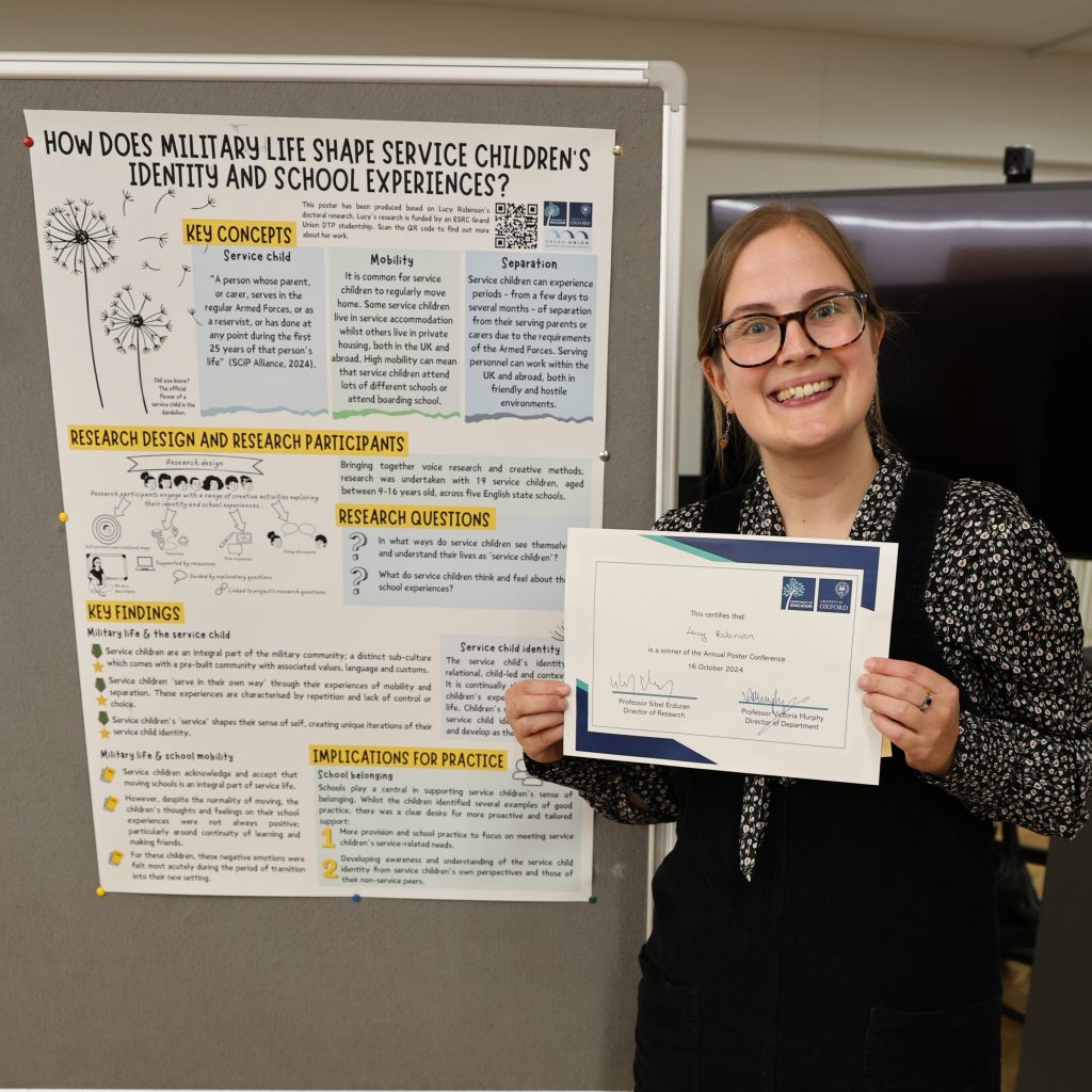 Lucy with poster and holding a certificate